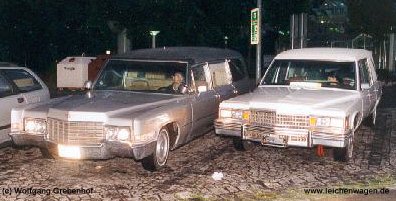 The two hearses at night